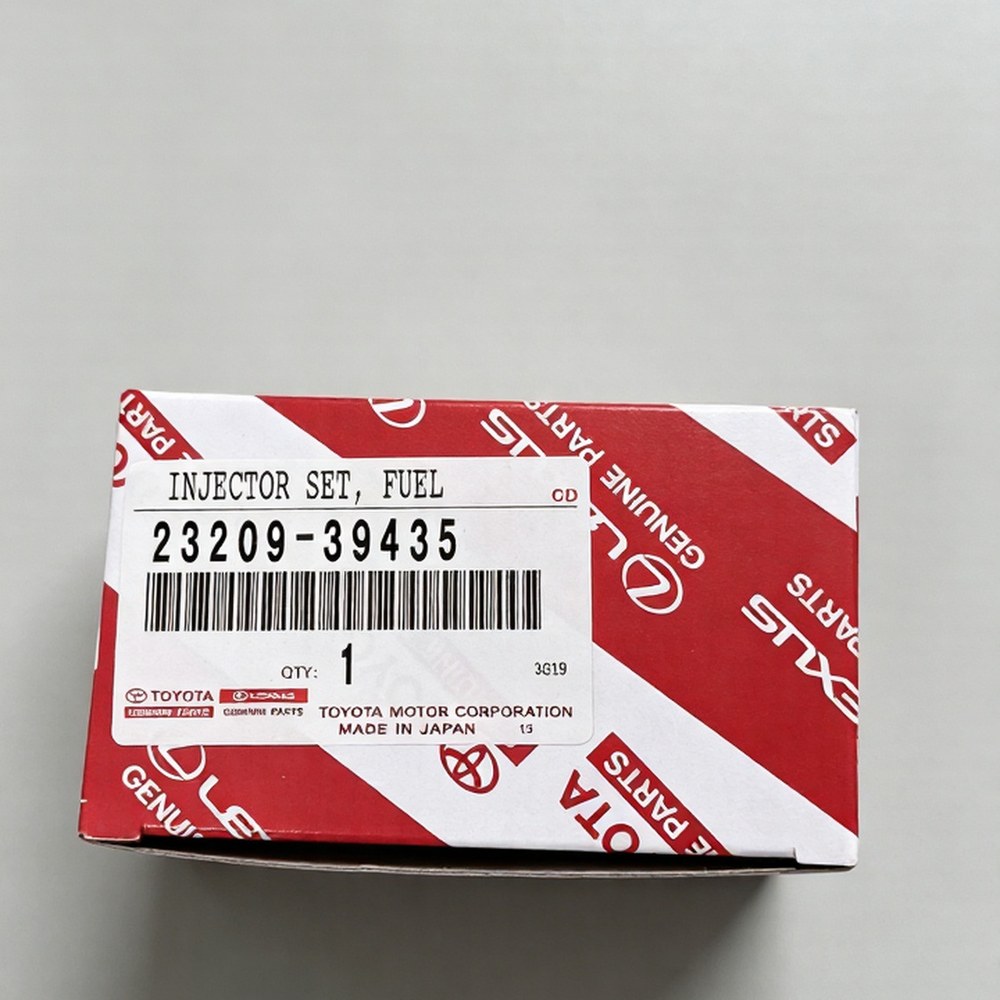 Genuine Toyota fuel injector 23209-09330 in original packaging — actual stock photo